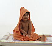 Boy wrapped in towel