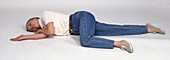 Woman lying in the recovery position