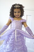 Girl wearing purple dress and tiara