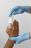 Applying tubular gauze bandage
