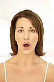 Woman engaging in facial exercise