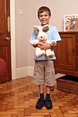 Boy holding soft toy