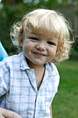 Blond baby boy smiling