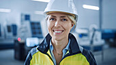 Smiling engineer working in a factory