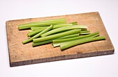 Celery sticks on a chopping board