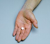 Hand offering a pill
