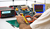 Computer motherboard repair in customer service laboratory