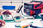Repairing computer parts in a laboratory