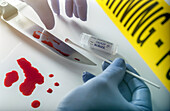 Forensic scientist collecting evidence from knife