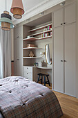 Bedroom with built-in wardrobe, dressing table and pendant lights