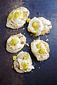 Brown sugar meringues with gooseberry compote and cream