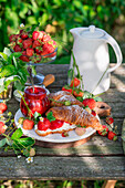 Strawberry jam with croissant and cream cheese