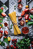 Colourful tomatoes, pesto rosso, spaghetti and basil