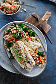 Baked fish with pearl barley, kale and vegetables