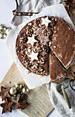 Hazelnut chestnut tart with chocolate cream and cinnamon stars