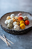 Various goat's cheese balls with herb and spice coatings