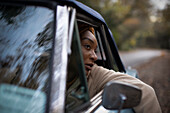 Young woman in car window