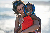 Happy cute toddler daughter and mother