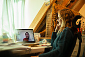 Woman video chatting with colleague