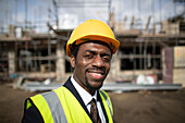 Confident architect at construction site