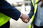 Foreman and engineer shaking hands