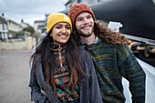 Happy young couple in stocking caps