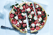 Sweet pizza with strawberries, pesto, and feta