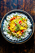 Cambodian vegetable curry with rice and pine nuts