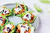 Stuffed salad leaves with chicken and yoghurt dressing