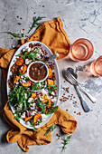 Lentil salad with sweet potatoes, feta cheese, and rocket