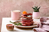 Beetroot pancakes with cream cheese and salted salmon