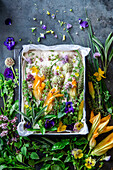 Raw garden foccacia with herbs and edible flowers