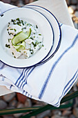 Baked cod salad with cucumber and chives