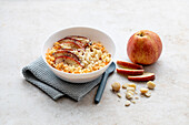 Millet porridge with roasted apple and macadamia nuts