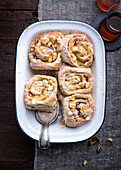 Vegan yeast buns with apple-walnut filling with icing