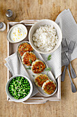 Fish meatballs with rice, butter peas and lemon yoghurt