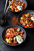 Sausage goulash with potatoes and peppers