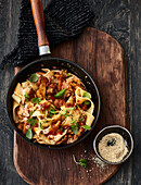 Vegan pappardelle with wild mushroom-tomato-sugo and cashew 'cheese'