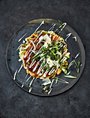 Vegan okonomiyaki (white cabbage pancakes with topping)
