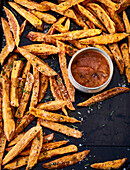 Vegan sweet potato fries with tomato sauce
