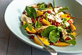 Chicken breast with spinach, mango and chilli