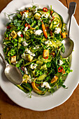 Cucumber salad with carrots, pea shoots, ricotta and croutons