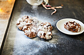Dusting cranberry cookies with icing sugar