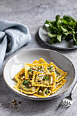 Spinach ravioli with pine nuts and mint