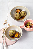 Chocolate and apricot dumplings rolled in pistachios and cinnamon sugar with salty nut butter