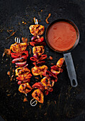 Grilled turkey skewers with peppers and red onions