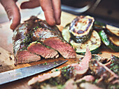 Grilled lamb fillet with herb-oil marinade