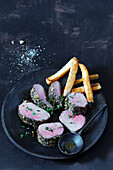 Pork tenderloin with herb crust and fries