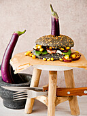 Japanese Fried eggplant on a black burger bun