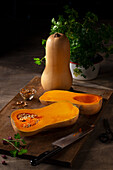 Whole and cut Butternut squash with parsley